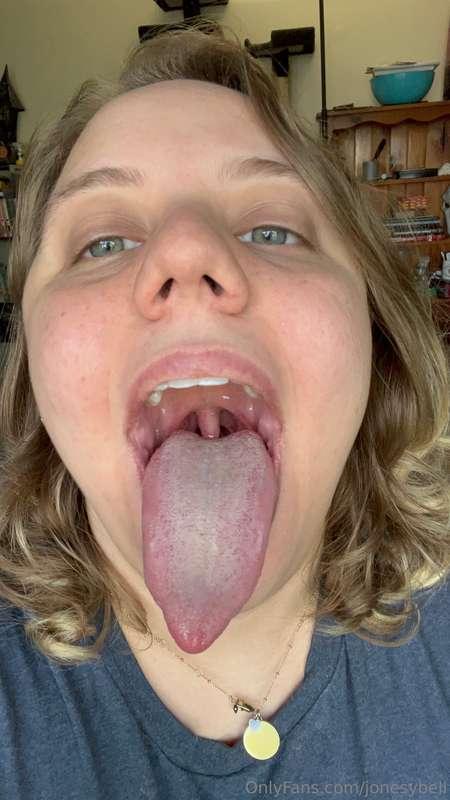 Long white tongue doing some tongue tricks and sticking it o..