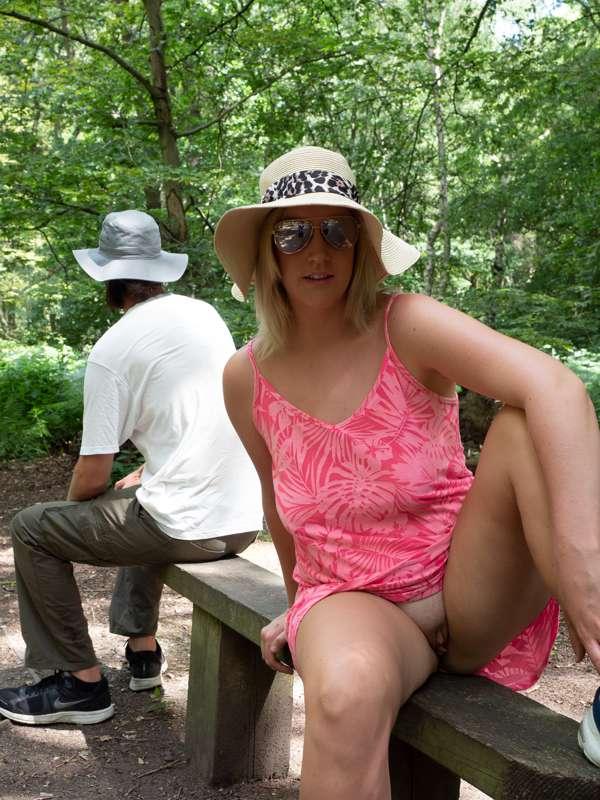 Sitting down on this bench flashing my pussy (no panties on)..