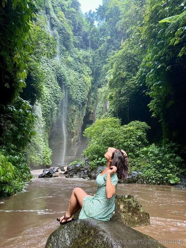 Sitting on a warm rock by the waterfall, and the world feels..
