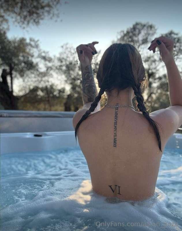 As I dip into the crystalline waters of the pool, a serene c..