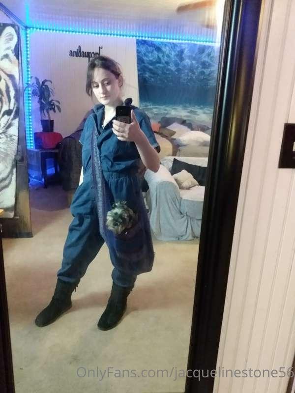 Lady painter with puppy in a purse