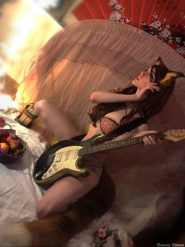 Sexy Fox with a guitar