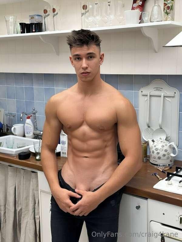 In the kitchen, abs tight, pants sliding down slow—cock star..