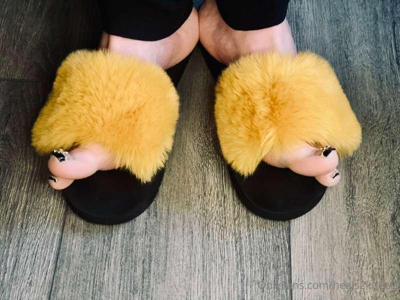 Fuzzy mustard and black slides, black French tip pedicure wi..