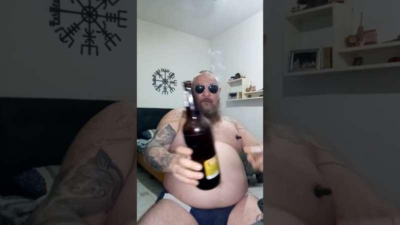 Smoking and showing the fat belly