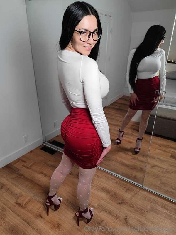 #1025 - White top and patterned pantyhose with a red skirt a..
