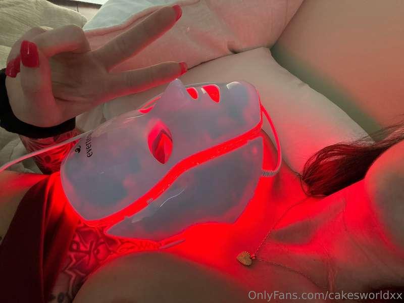 Healing my titty with my read light mask 😂😭