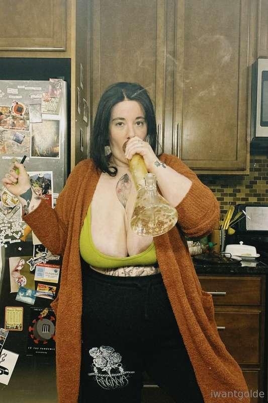 Truest form (titties out, sucking on a bong)
