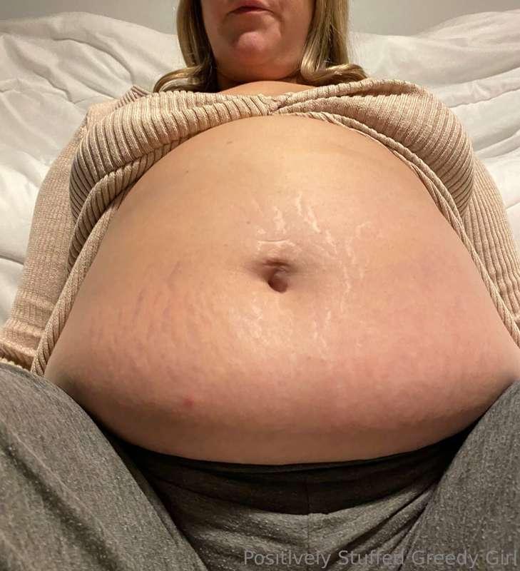 I was full. I sat on the floor, my engorged belly bulging ou..
