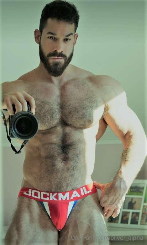 Snapping the shot with my camera, abs out, cock hard in my b..