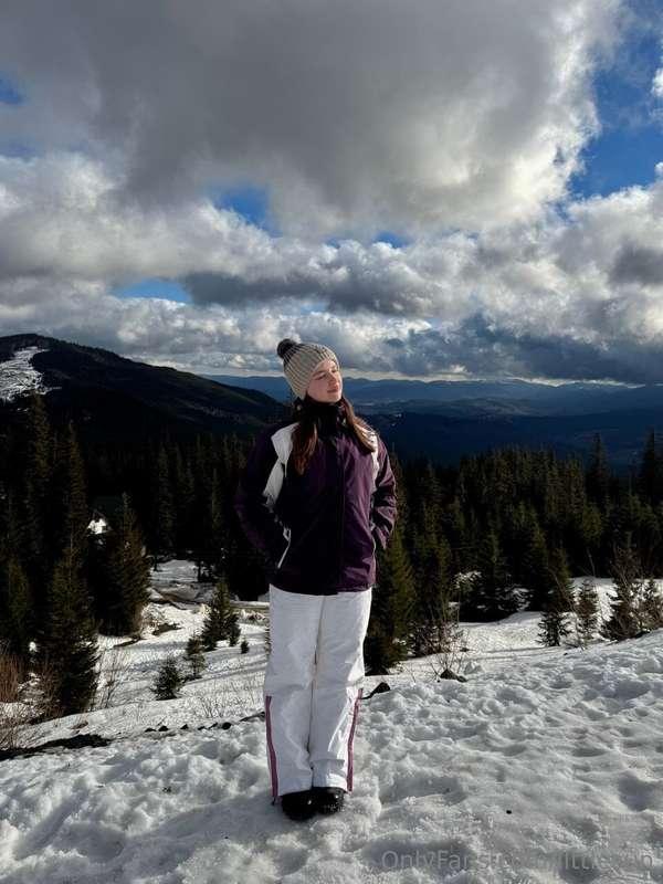 I'm standing on top of a mountain surrounded by snow-covered..