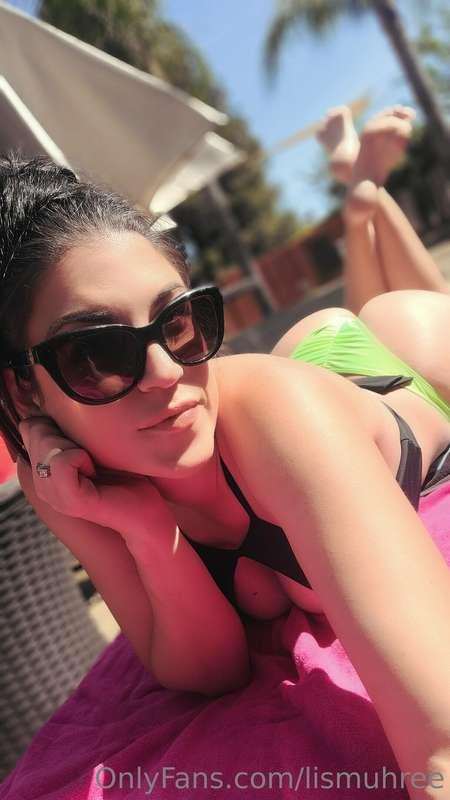 Just chillin poolside with a drink in hand enjoying the day...