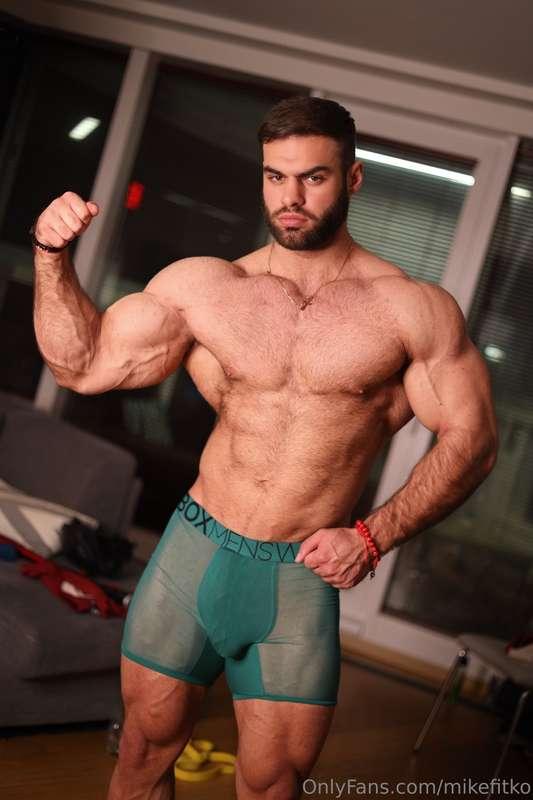 Flexing biceps and showing off the abs boxers tight around a..