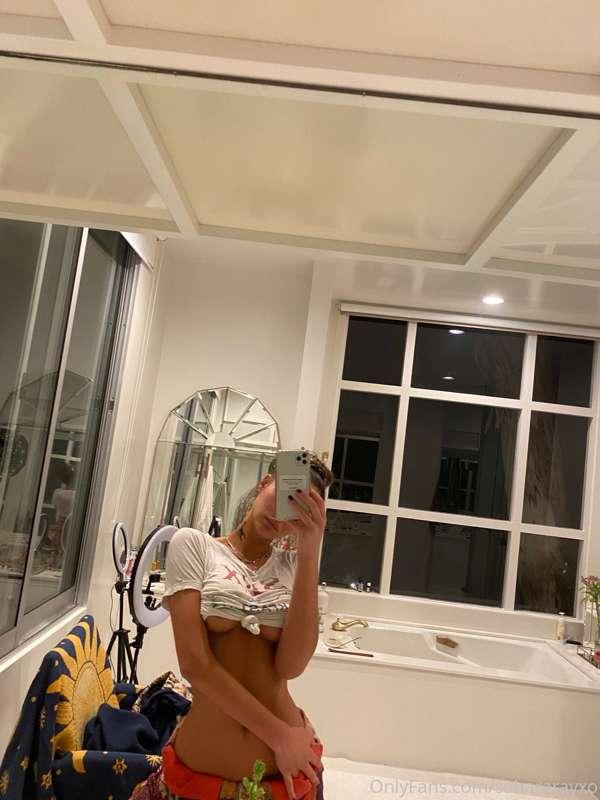Pulling up my tiny white top...just bc I’m feeling a bit nau..