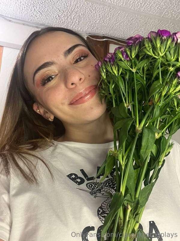 Here with a big smile smelling some beautiful flowers, do yo..