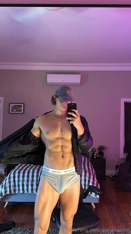 Leather jacket slipping off, just enough to tease the abs un..