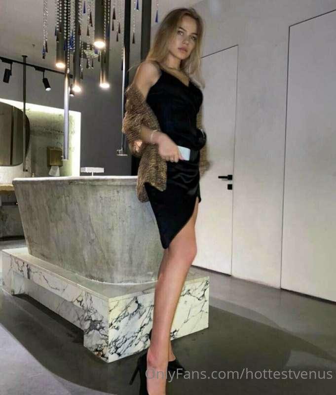 This black dress needs to be on the floor, and your hands mu..