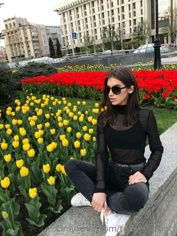 Surrounded by a sea of tulips, where every petal tells a sto..