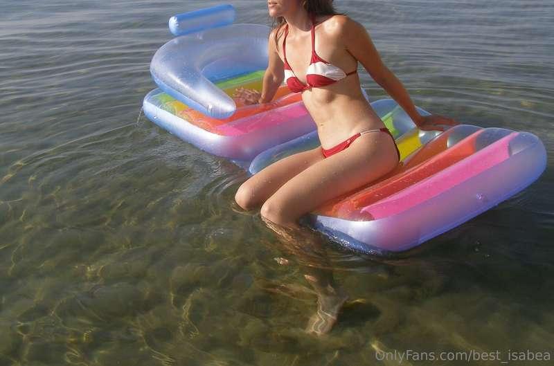 Shy bikini girl on air mattress