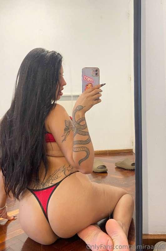 My red outfit is so small that it shows all over my big ass...