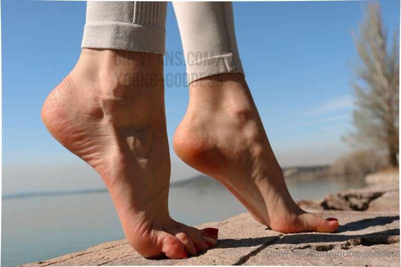 Bare feet by the lake