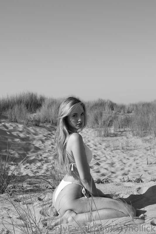 On my knees in the sand