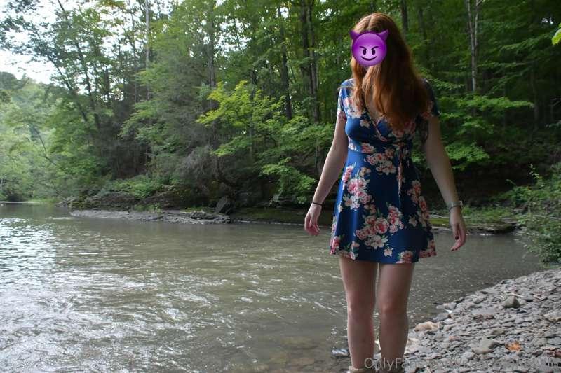By the river.