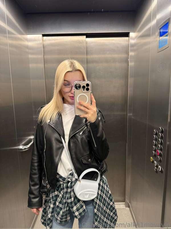 Standing in the elevator, looking at my reflection and reali..